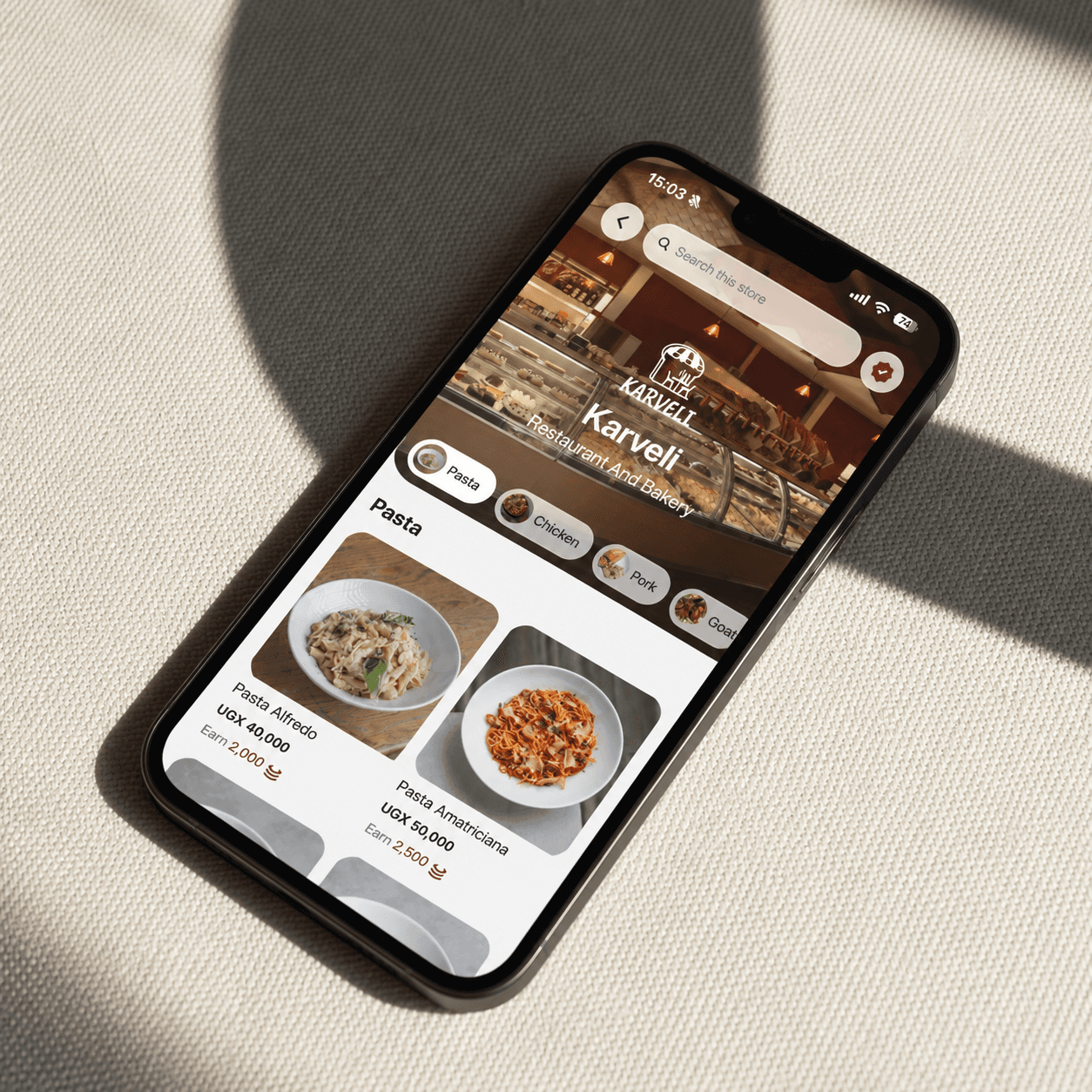 A phone showing the Karveli storefront menu on Coinz, with Coinz earned on each dish